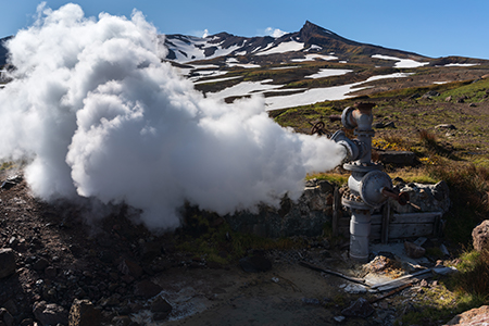 Natural mineral thermal steam-water emission from well, geothermal deposit